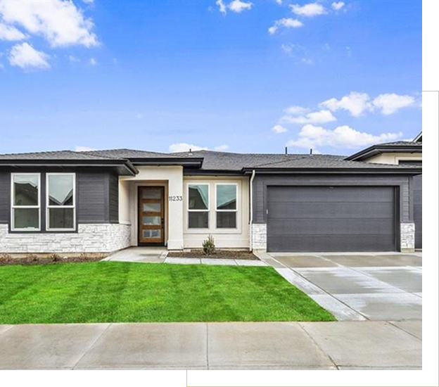 Modern single-story house with a clean lawn and attached garage.