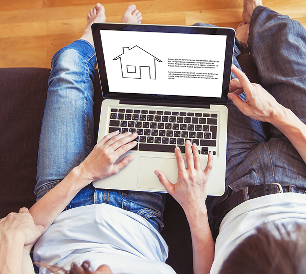 Laptop displaying home design illustration